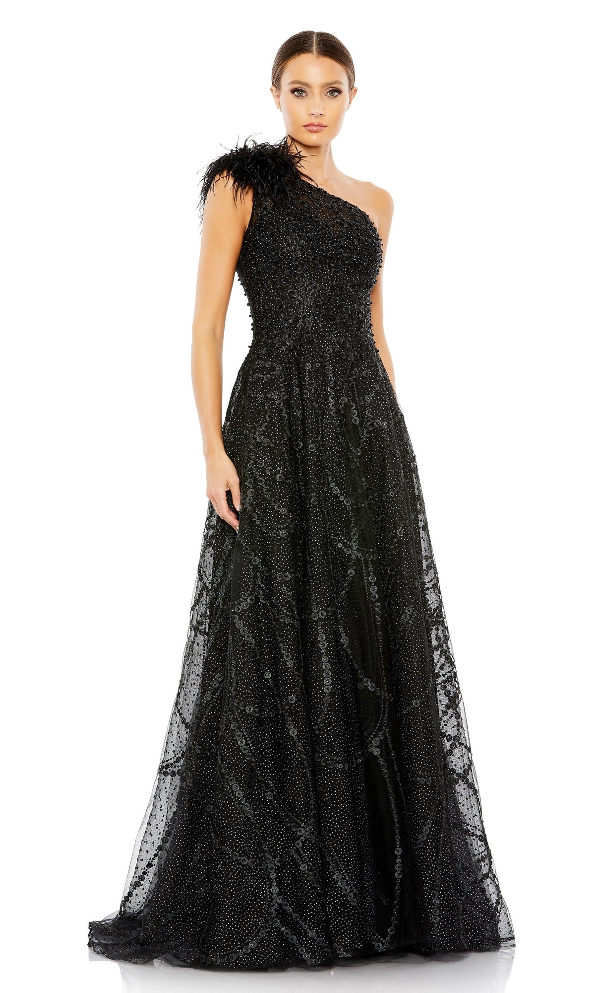 A woman wears the Beaded One-Shoulder Prom Gown: Mac Duggal 20389, an elegant evening dress with textured beading and a feathered shoulder accent—perfect for formal events and special occasions.